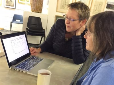 Two women working on an art and oral history film making