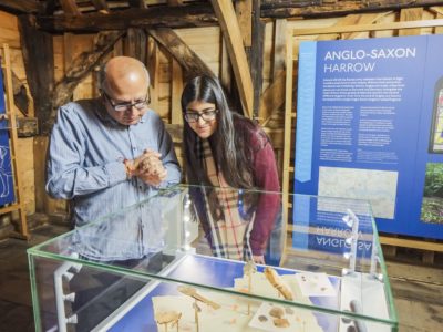 Adult and child looking intently at an Anglo-Saxon exhibit