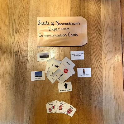 Image taken from the Battle of Bannockburn NTS’ Twitter account showing their communication cards and commitment to inclusion & access.